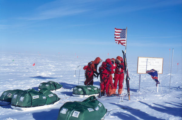 A team of skiers arriving at the South Pole