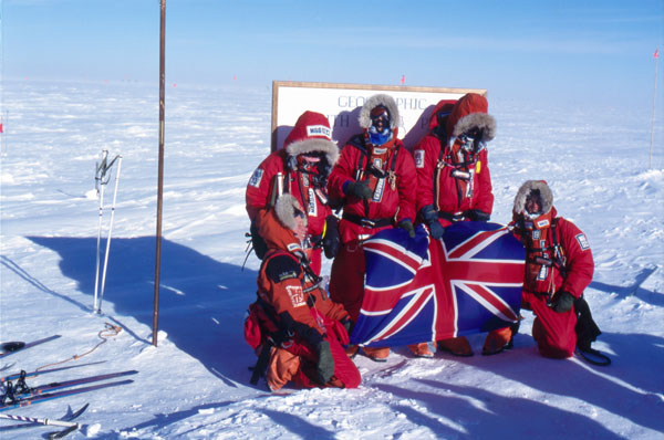 A team of skiers arriving at the South Pole